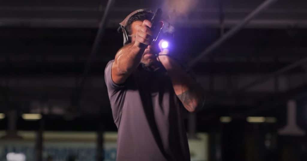 Officer-Holding-A-Flashlight